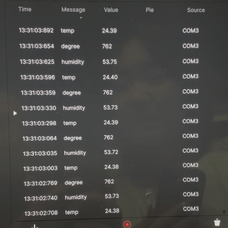 Real-time code updates on temperature and humidity displaying on the ProtoPie interface.
